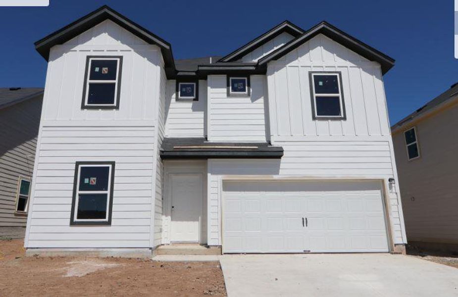Front exterior of a new home in Cascades at Onion Creek, Austin, TX, highlighting curb appeal (Image 2). Front exterior of a new home in Cascades at Onion Creek, Austin, TX, highlighting curb appeal (Image 2).