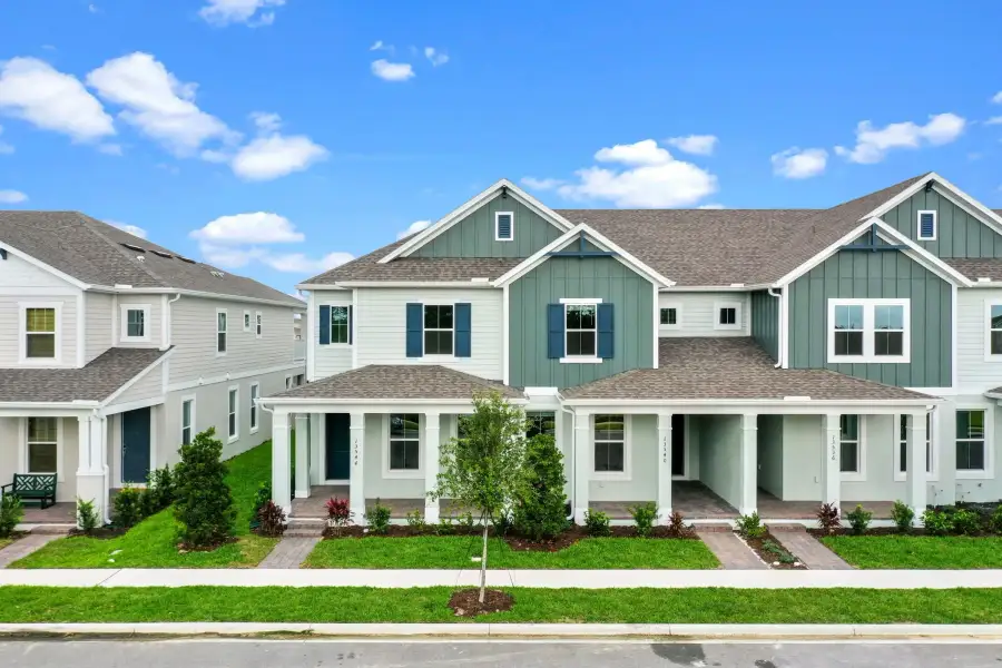 Representative exterior photo of a completed home built from the Franklin by Rockwell Homes in Harvest at Ovation - Townhomes, Winter Garden, FL (Image 30).