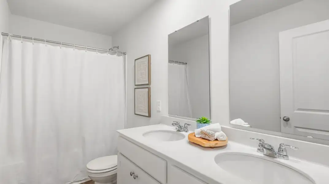 Furnished interior view inside a new home in Pine Hills Townhomes at Cane Bay, Summerville (Image 19).
