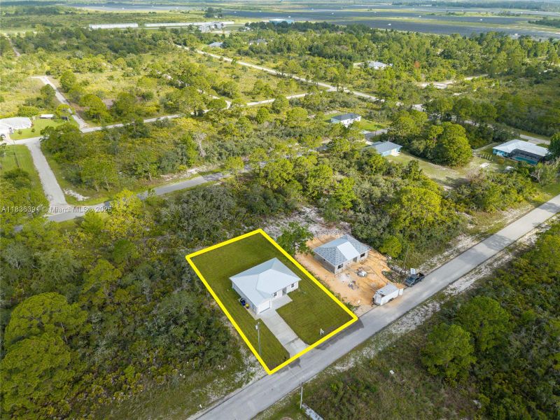 Front exterior of a new home in , Lake Placid, FL, highlighting curb appeal (Image 21).