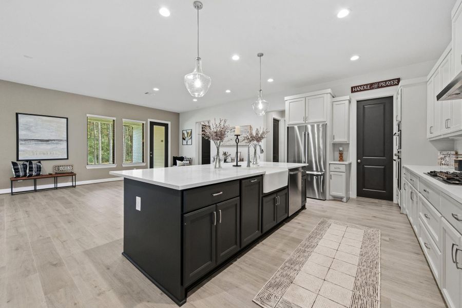 This beautiful kitchen boasts High end Bosch appliances and plenty of cabinetry for storage.