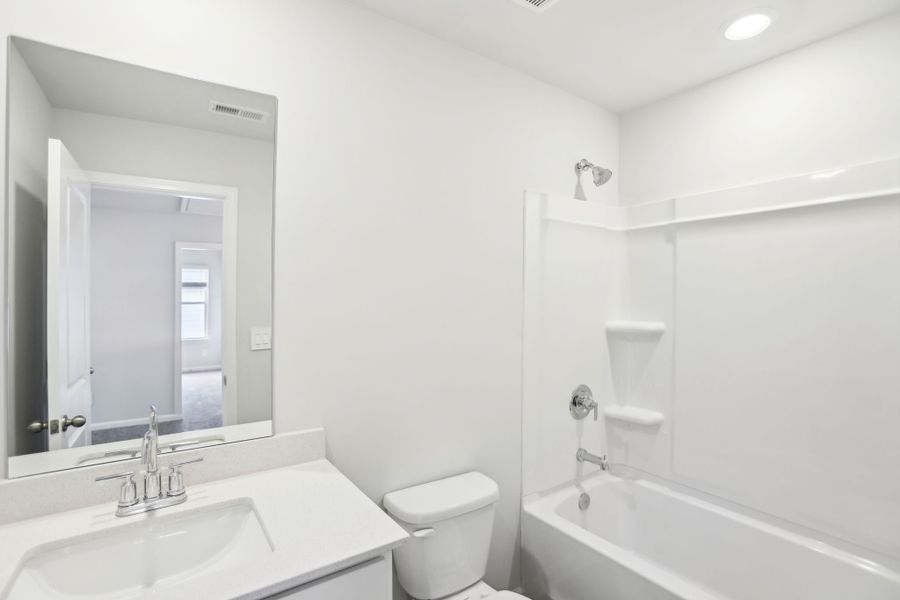 Furnished interior view inside a new home in Hemingway - Reserve Series, Cumming (Image 6). Furnished interior view inside a new home in Hemingway - Reserve Series, Cumming (Image 6).
