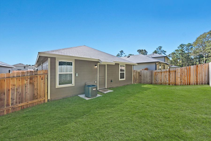 Exterior details and patio area of a home in , Conroe (Image 3).