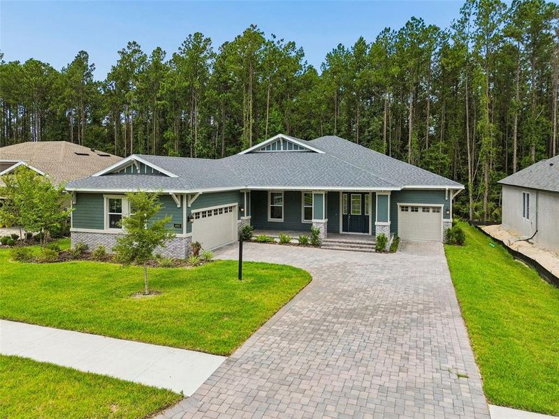 Front exterior of a new home in Southern Hills Plantation, Brooksville, FL, highlighting curb appeal (Image 1). Front exterior of a new home in Southern Hills Plantation, Brooksville, FL, highlighting curb appeal (Image 1).