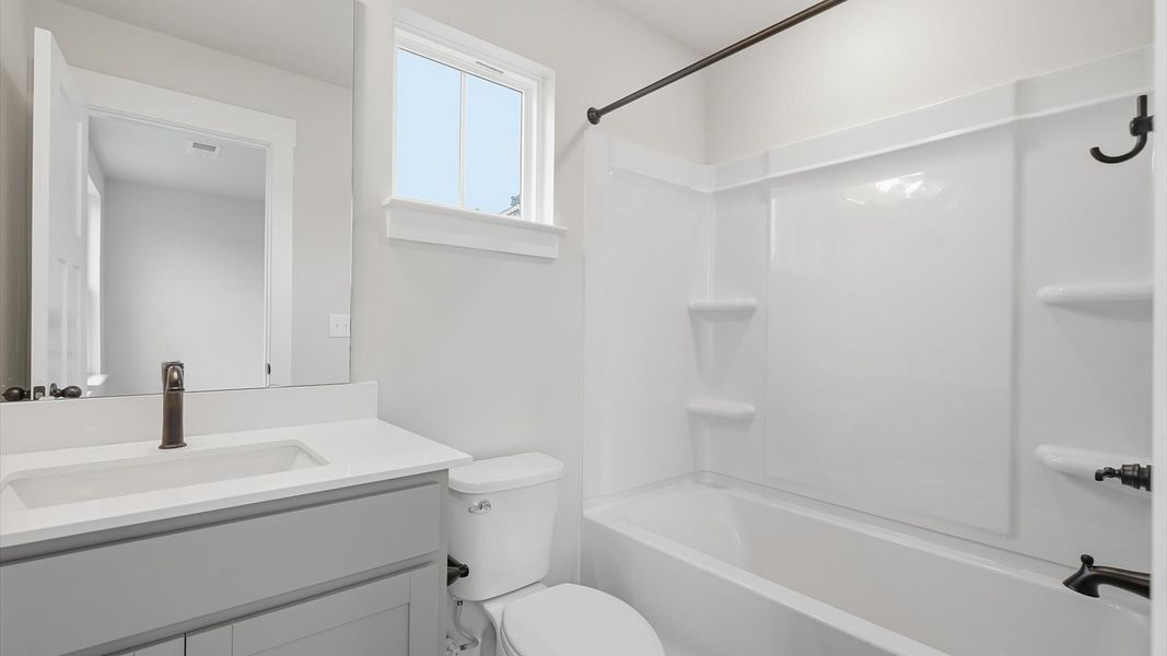 First-class guest bath featuring stylish fixtures and modern design elements located in Piedmont, SC First-class guest bath featuring stylish fixtures and modern design elements located in Piedmont, SC