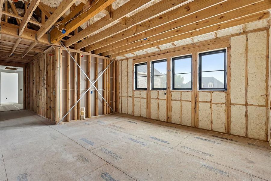 Open framing construction featuring exposed wooden joists and studs