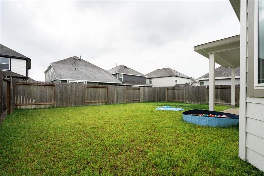 Front exterior of a new home in River's Edge, Conroe, TX, highlighting curb appeal (Image 29). Front exterior of a new home in River's Edge, Conroe, TX, highlighting curb appeal (Image 29).