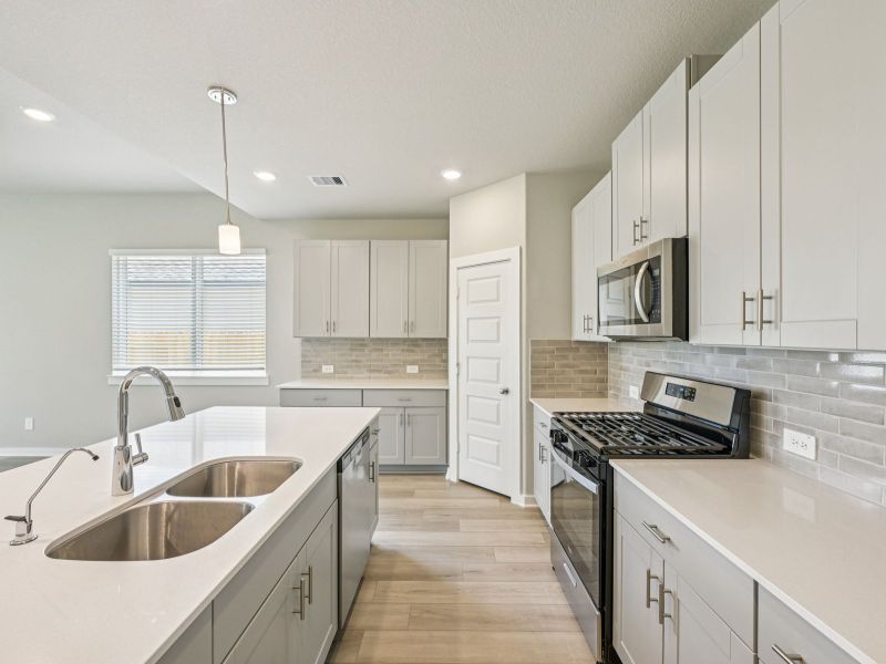 Furnished interior view inside a new home in Heights of Barbers Hill, Baytown (Image 3).