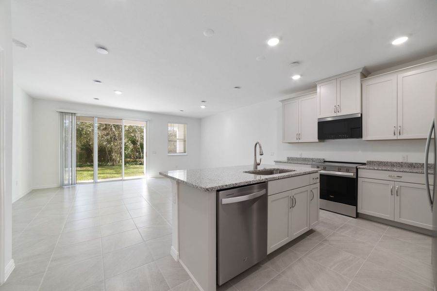 Furnished interior view inside a new home in Towns at Greenleaf, Oviedo (Image 8).