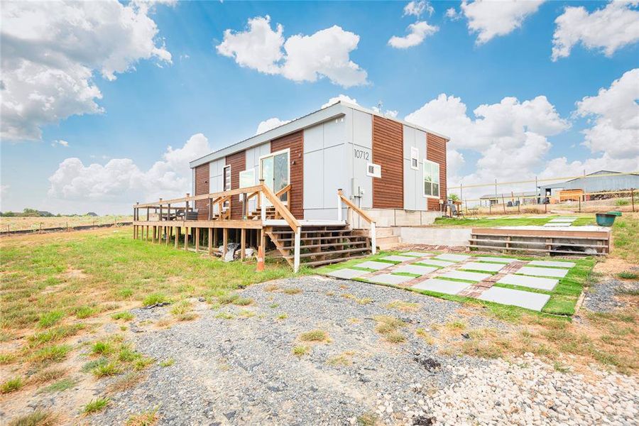 Rear view of house with a deck Rear view of house with a deck