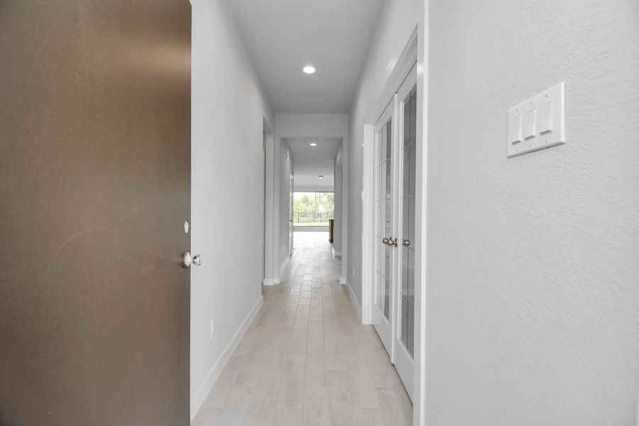 As you step into the threshold of this luxurious home, you'll soon be welcomed by an elegant glass door (to be installed). Inside, soaring ceilings amplify the spaciousness, while the refined wood-look tile flooring and oversized baseboards exude sophistication and charm. As you step into the threshold of this luxurious home, you'll soon be welcomed by an elegant glass door (to be installed). Inside, soaring ceilings amplify the spaciousness, while the refined wood-look tile flooring and oversized baseboards exude sophistication and charm.