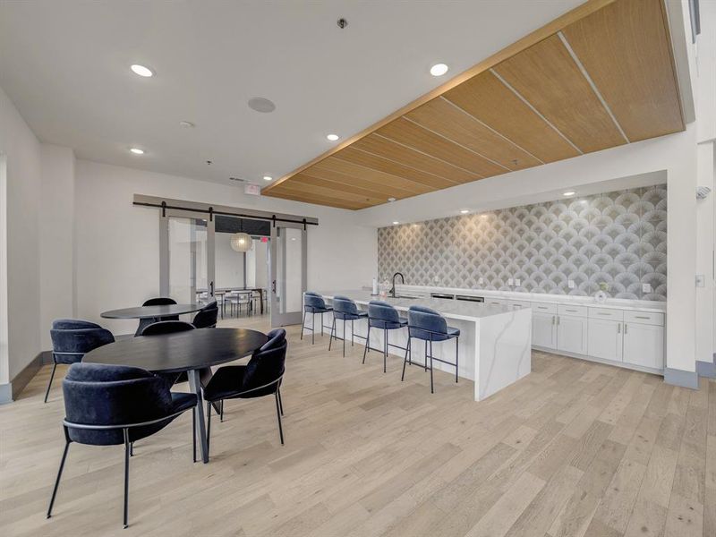 Dining room featuring recessed lighting, a barn door, light wood-style floors, and wooden ceiling Dining room featuring recessed lighting, a barn door, light wood-style floors, and wooden ceiling
