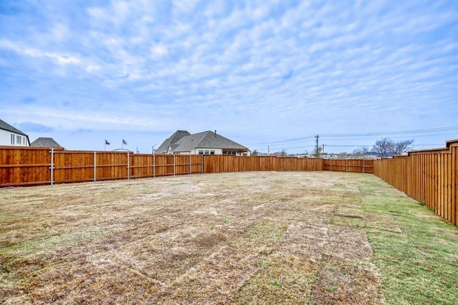 View of fenced backyard