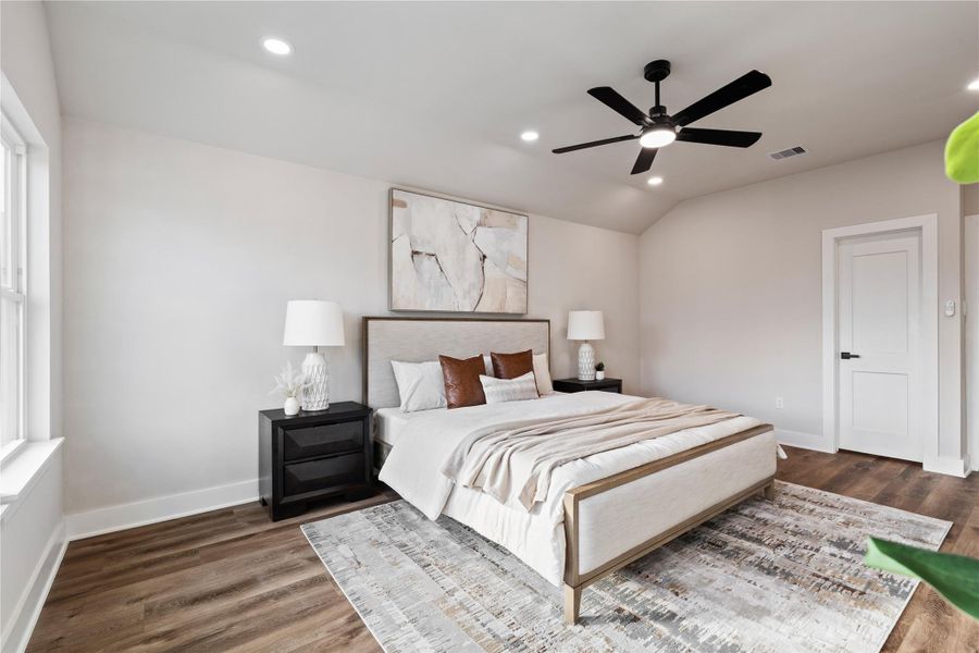 The primary bedroom feels like a true retreat with high ceilings, soft natural light, and a calm, spacious layout. It’s the perfect place to unwind at the end of the day while still feeling bright and airy.
