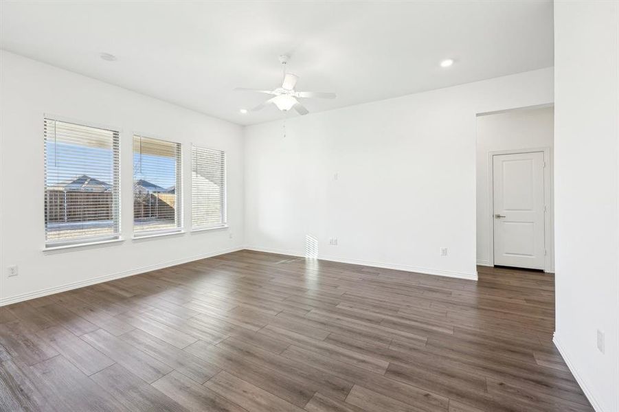 Spare room with ceiling fan and dark hardwood / wood-style flooring