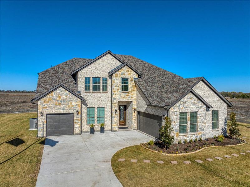 Front exterior of a new home in Pioneer Estates, Blue Ridge, TX, highlighting curb appeal (Image 20).