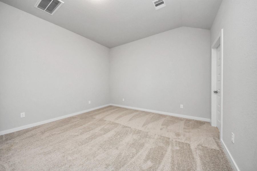 Another perspective unveils a comprehensive view of the serenity and comfortthis primary suite offers. Sample photo of completed home with similar floor plan. Actual colors and selections may vary. Another perspective unveils a comprehensive view of the serenity and comfortthis primary suite offers. Sample photo of completed home with similar floor plan. Actual colors and selections may vary.