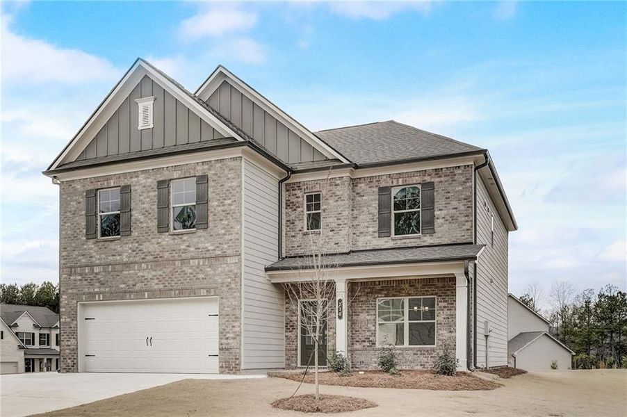 Front exterior of a new home in Summerlin, Winder, GA, highlighting curb appeal (Image 22).