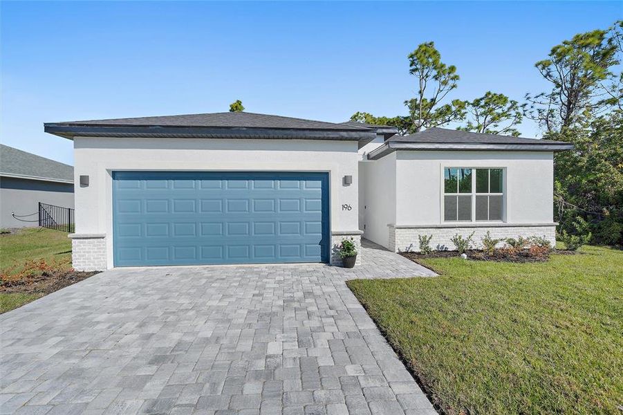 Front exterior of a new home in , Rotonda West, FL, highlighting curb appeal (Image 26). Front exterior of a new home in , Rotonda West, FL, highlighting curb appeal (Image 26).