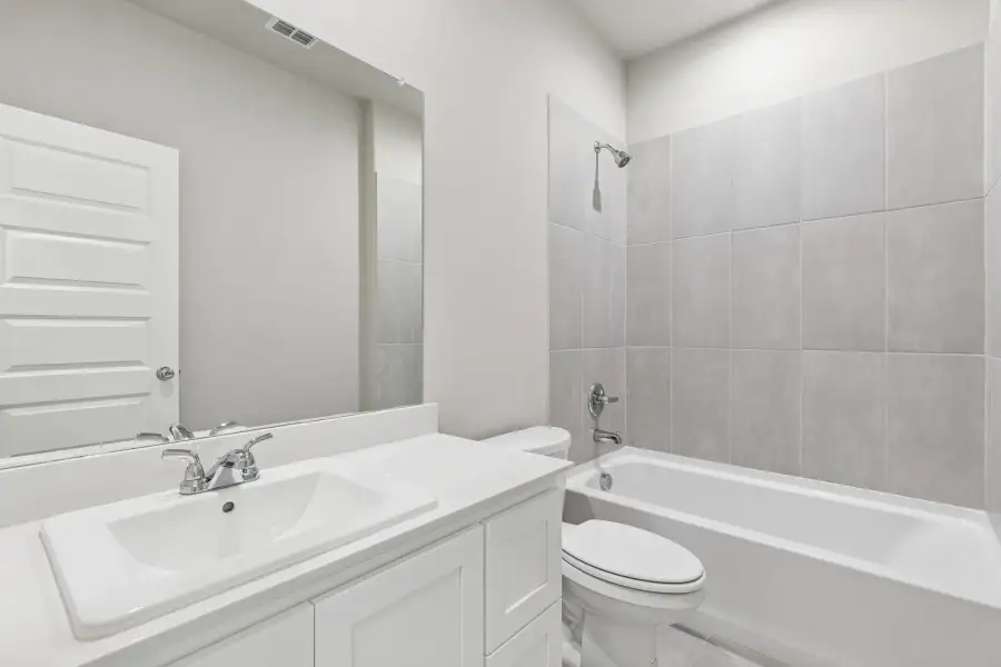 Bathroom in the Holden home plan by Trophy Signature Homes – REPRESENTATIVE PHOTO