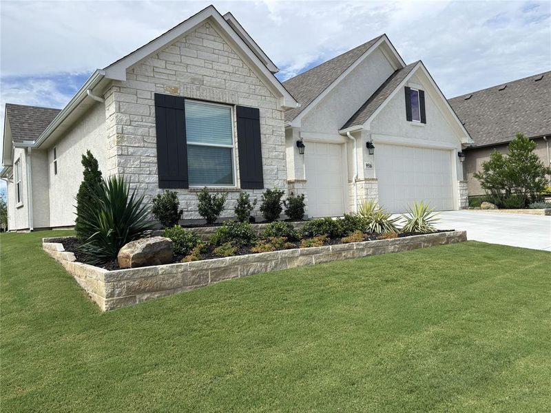 Front exterior of a new home in , Denton, TX, highlighting curb appeal (Image 1). Front exterior of a new home in , Denton, TX, highlighting curb appeal (Image 1).