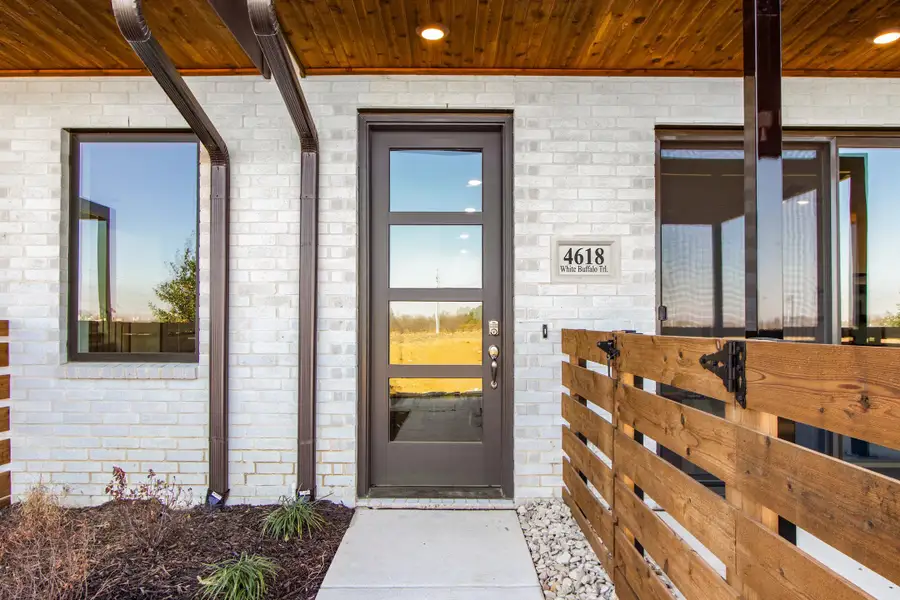 Exterior details and patio area of a home in Wildridge, Oak Point (Image 3).