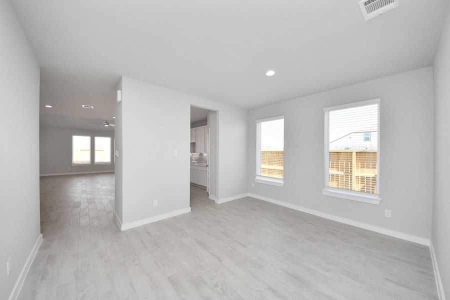Make memories gathered around the table with your family and friends! This spacious dining room features elegant flooring, custom paint, and adjacent to family room and kitchen for open concept feel. Sample photo of completed home with similar floor plan. Actual colors and selections may vary. Make memories gathered around the table with your family and friends! This spacious dining room features elegant flooring, custom paint, and adjacent to family room and kitchen for open concept feel. Sample photo of completed home with similar floor plan. Actual colors and selections may vary.