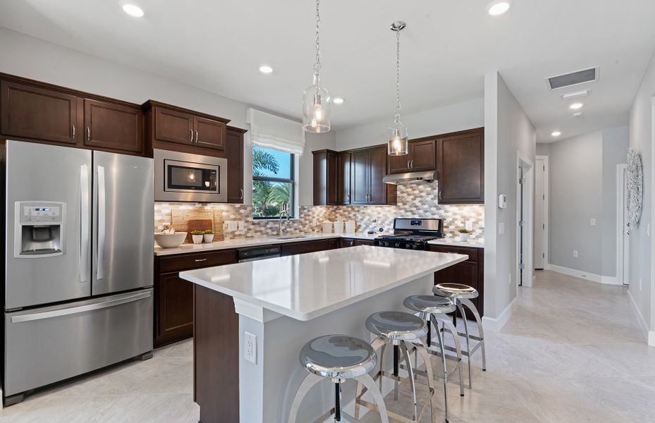 Kitchen with large center island and stainless ste