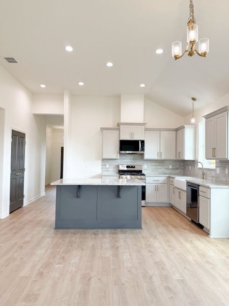 Furnished interior view inside a new home in TerraVista, Victoria (Image 13).