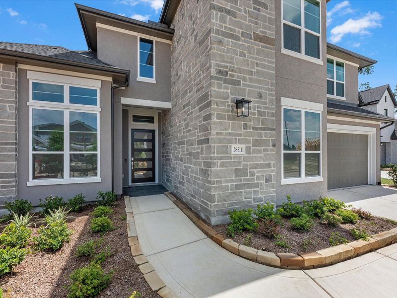 Exterior details and patio area of a home in Woodson’s Reserve, Spring (Image 4).