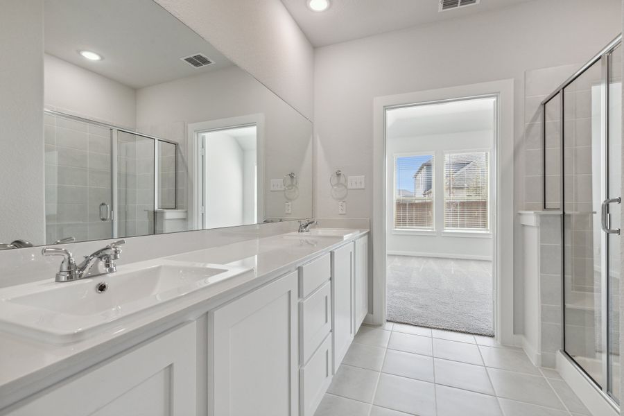 Primary Bathroom in the Mesquite home plan by Trophy Signature Homes – REPRESENTATIVE PHOTO