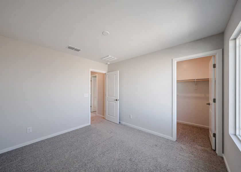A hallway with white walls.