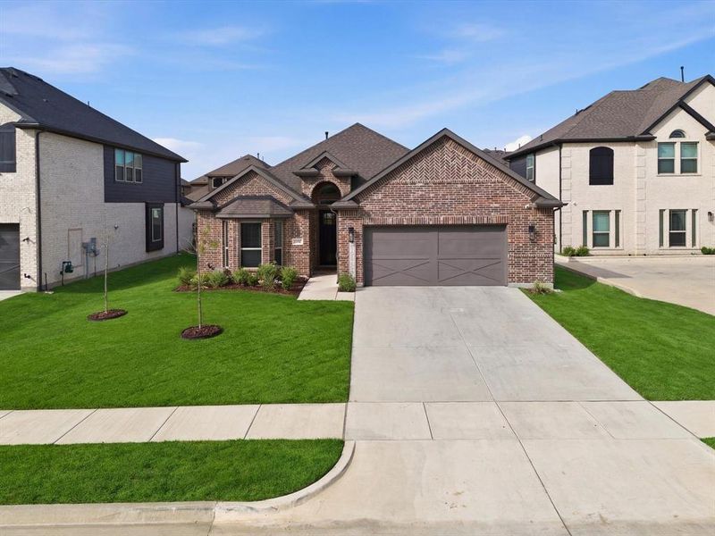 Front exterior of a new home in , Mansfield, TX, highlighting curb appeal (Image 21).