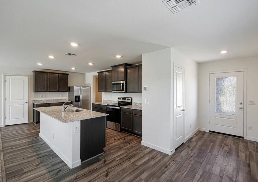 The kitchen comes with a full suite of energy-efficient appliances!