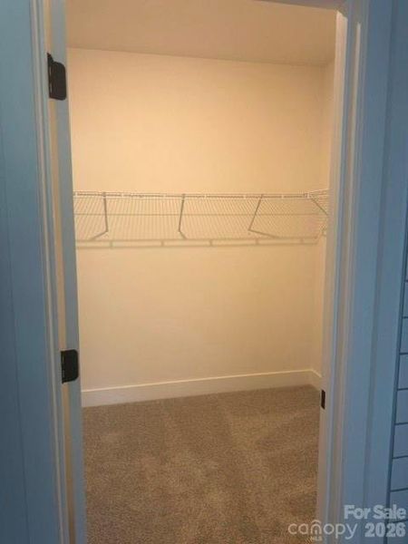 Large walk in closet in primary Large walk in closet in primary
