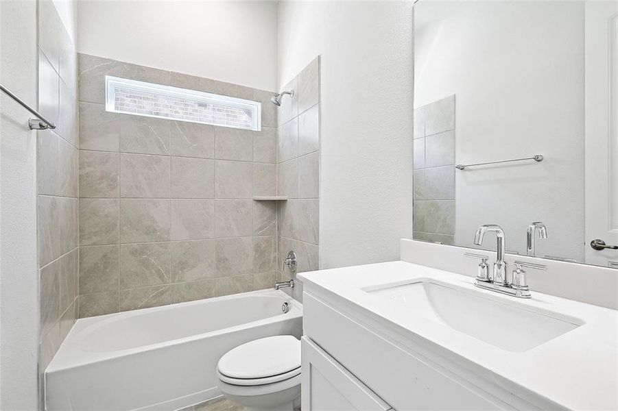 Full bathroom with shower / washtub combination and vanity