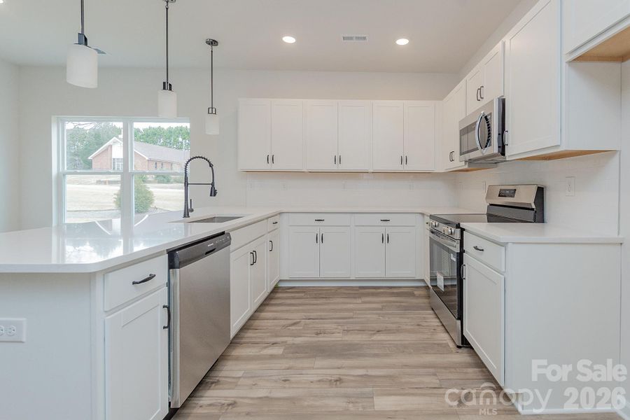 Furnished interior view inside a new home in Country Club Village, Salisbury (Image 8).