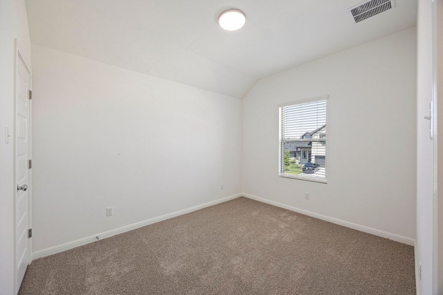 Bedroom in the Magnolia home plan by Trophy Signature Homes – REPRESENTATIVE PHOTO