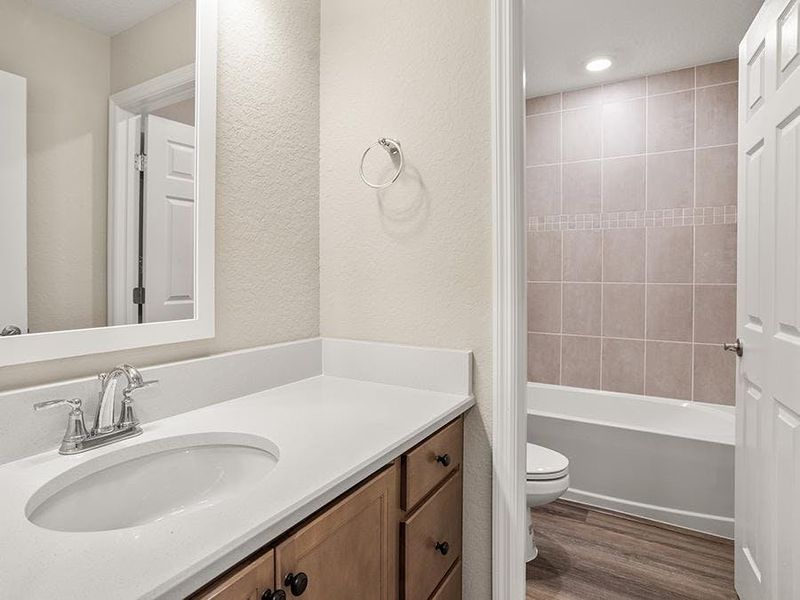 Secondary bedrooms share an upstairs hall bath.