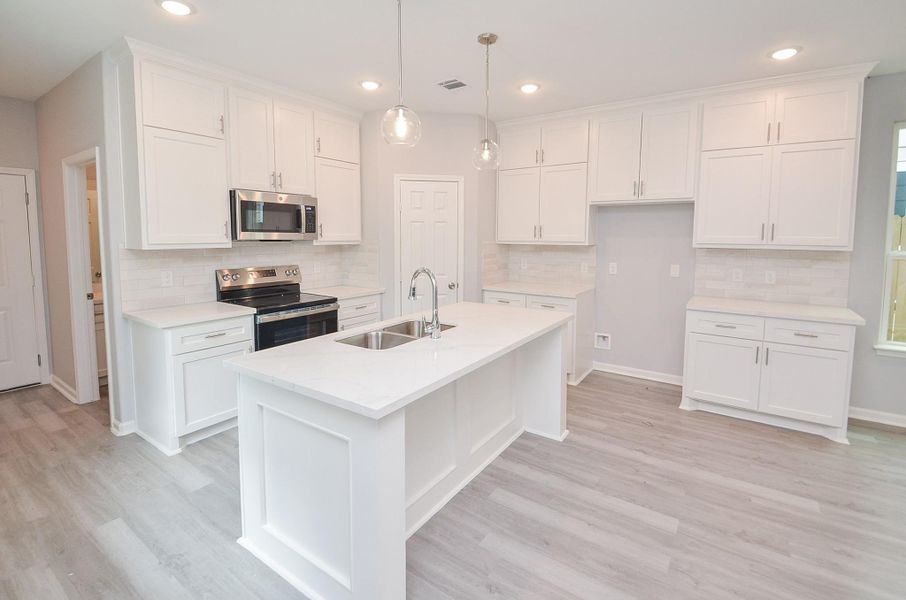 Defined dining space fits a full table and still feels open—great for everyday meals and hosting.