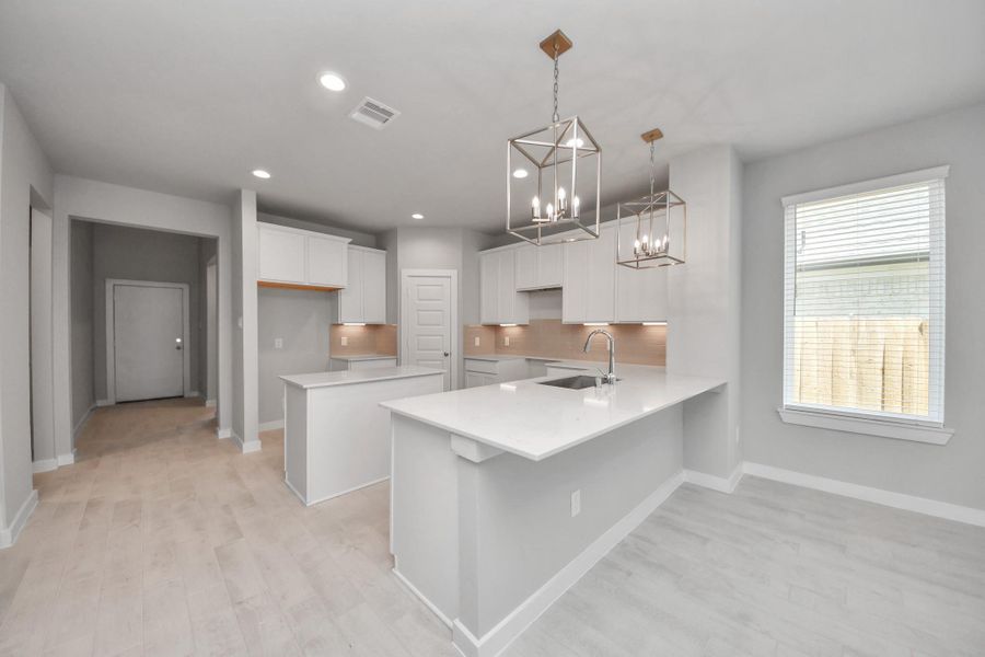 The extended counter area adds both practicality and style, making meal preparation a breeze. Every detail is thoughtfully designed to enhance the kitchen's functionality and aesthetic appeal.