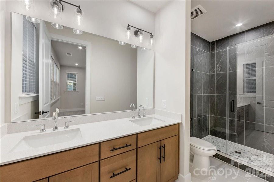 En Suite Primary Bath with Dual Vanity and Loads of Storage.