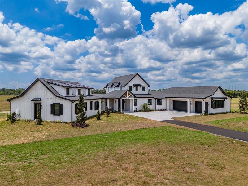 Front exterior of a new home in , Lithia, FL, highlighting curb appeal (Image 23).