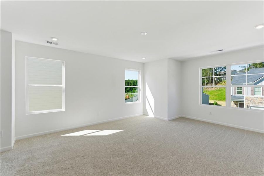 Spacious, unfurnished interior of a new home in The View at Groover’s Lake, Lithia Springs (Image 13).
