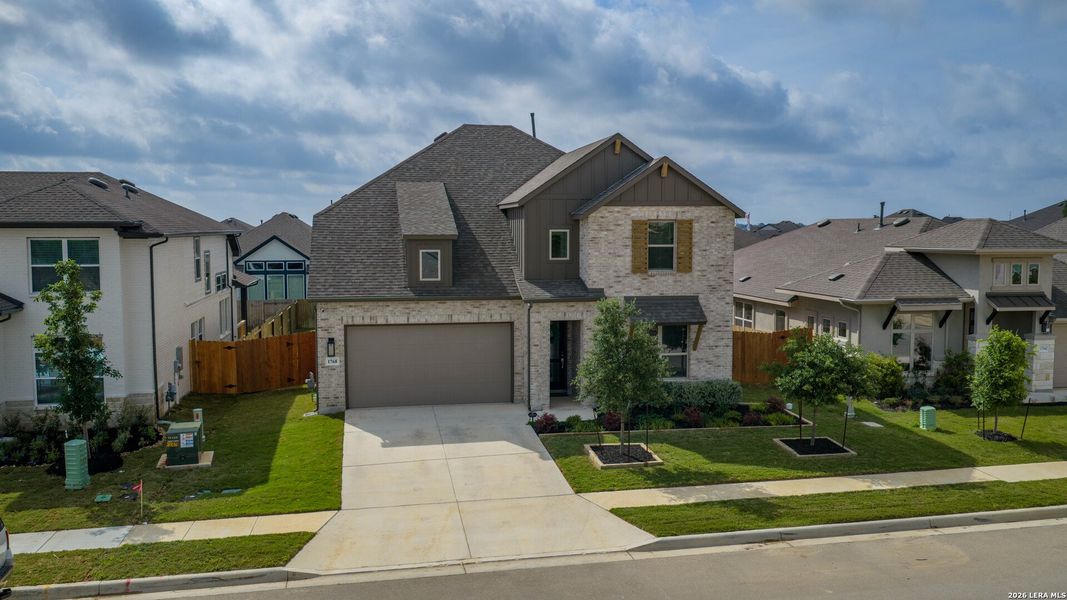 Front exterior of a new home in Meyer Ranch, New Braunfels, TX, highlighting curb appeal (Image 24).