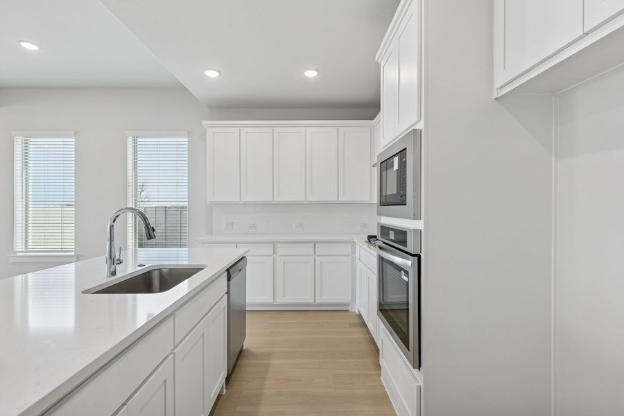 Kitchen in the Stanley II home plan by Trophy Signature Homes – REPRESENTATIVE PHOTO Kitchen in the Stanley II home plan by Trophy Signature Homes – REPRESENTATIVE PHOTO