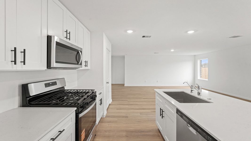 Furnished interior view inside a new home in Sunterra, Katy (Image 6).