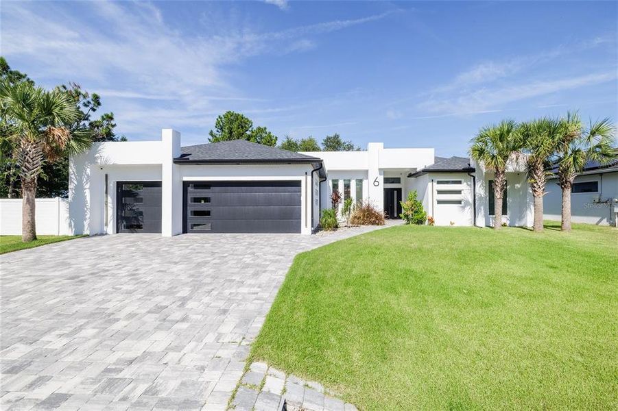 Front exterior of a new home in , Palm Coast, FL, highlighting curb appeal (Image 1).