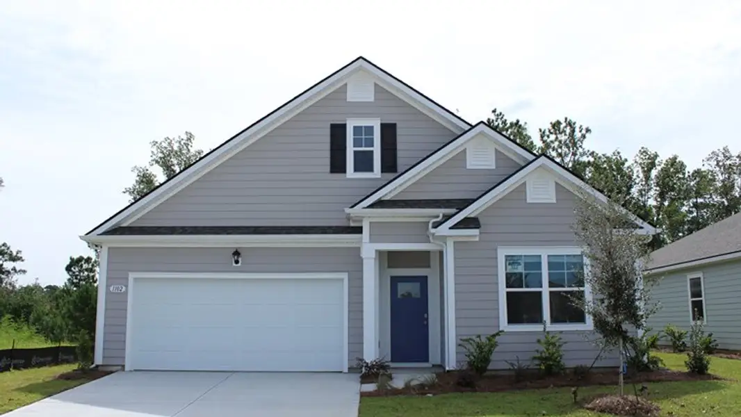 Front exterior of a new home in Hemingway Landing, Conway, SC, highlighting curb appeal (Image 2). Front exterior of a new home in Hemingway Landing, Conway, SC, highlighting curb appeal (Image 2).