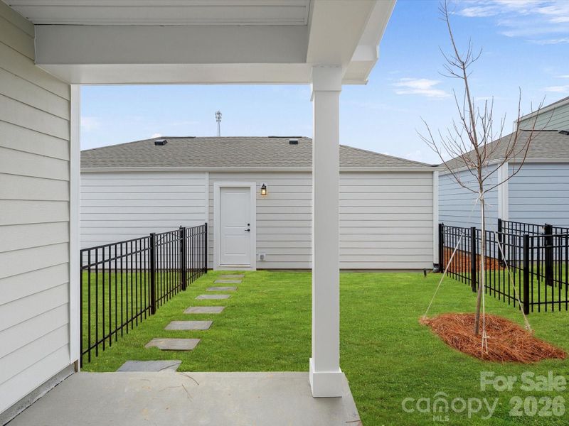 Exterior details and patio area of a home in North Creek Village, Huntersville (Image 4).